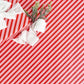 candy cane striped wrapping paper with a white bow