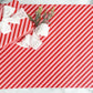 cand cane wrapping paper with a velvet white bow