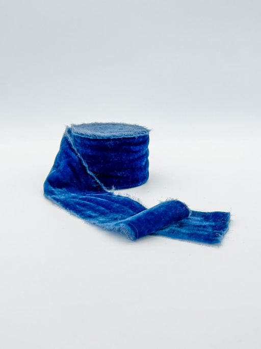 Blue velvet ribbon frayed edge