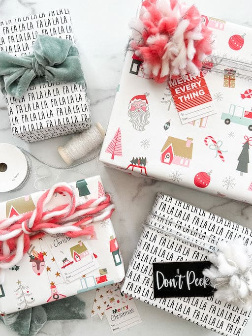 Christmas gifts with christmas wrapping paper and bows