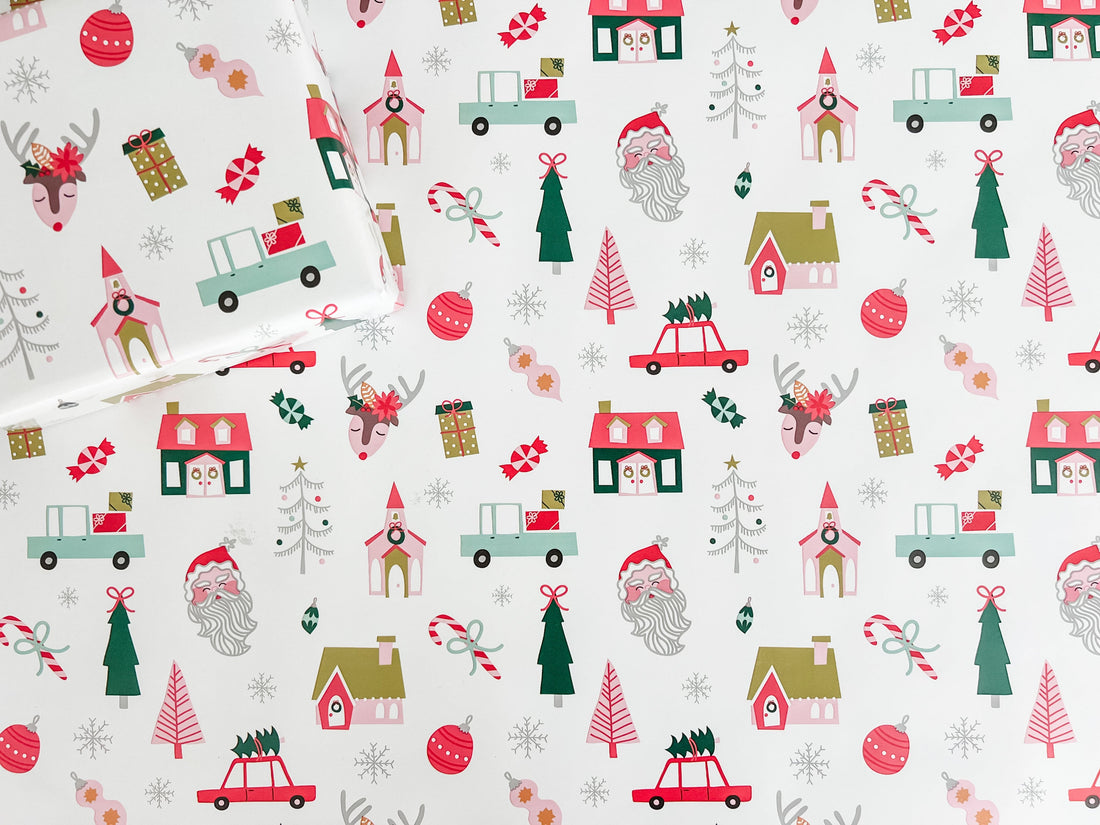 Christmas-themed wrapping paper with reindeer, Santa Claus, and trees on a white background.