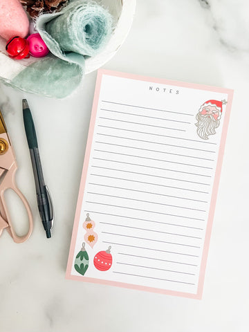 Christmas lined notepad with a santa and bulbs