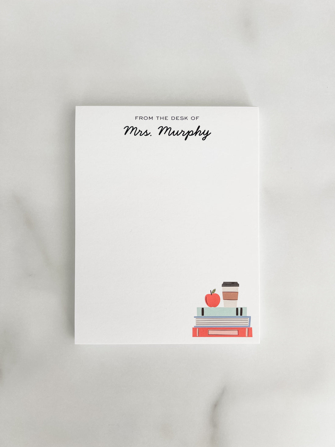 Personalized teacher notepad with a stack of books, apple and cup.