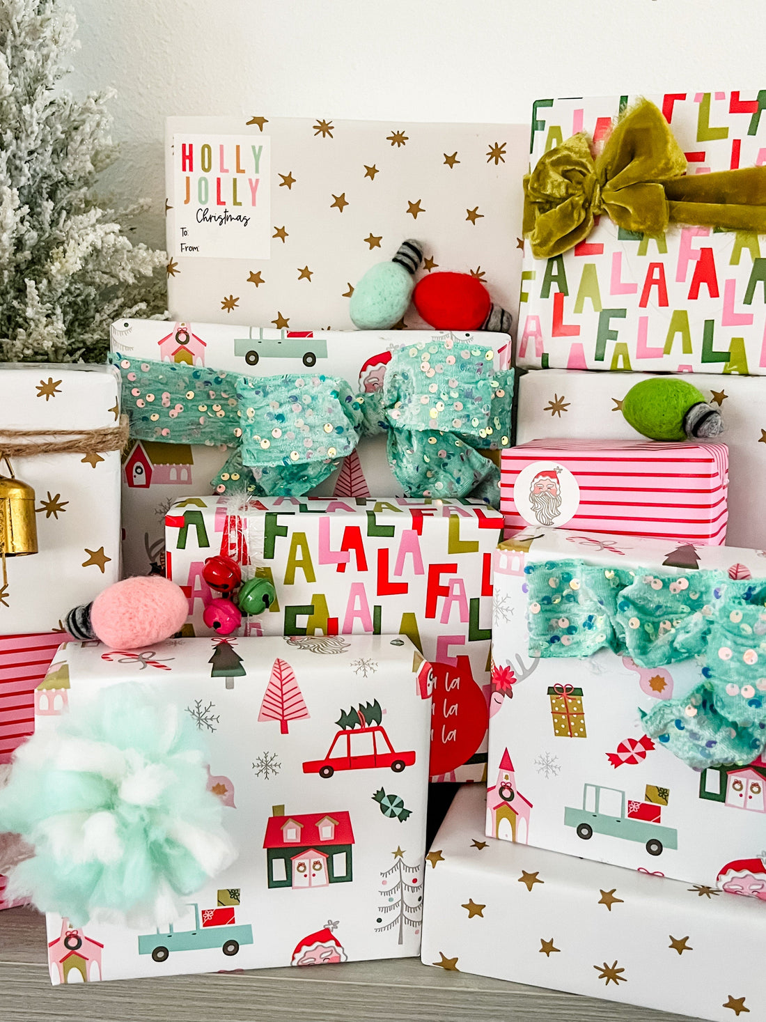 Three rolls of decorative paper with festive designs 