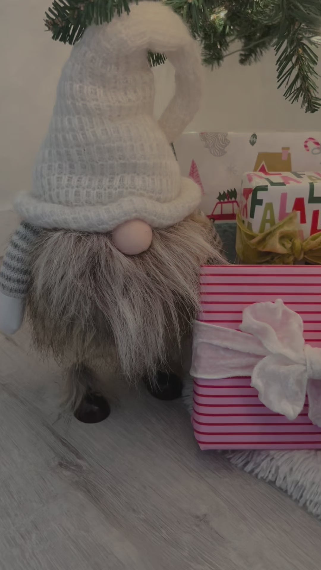 Video of wrapped Christmas gifts under a tree